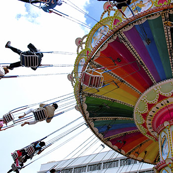 Amusement park swing ride in motiion
